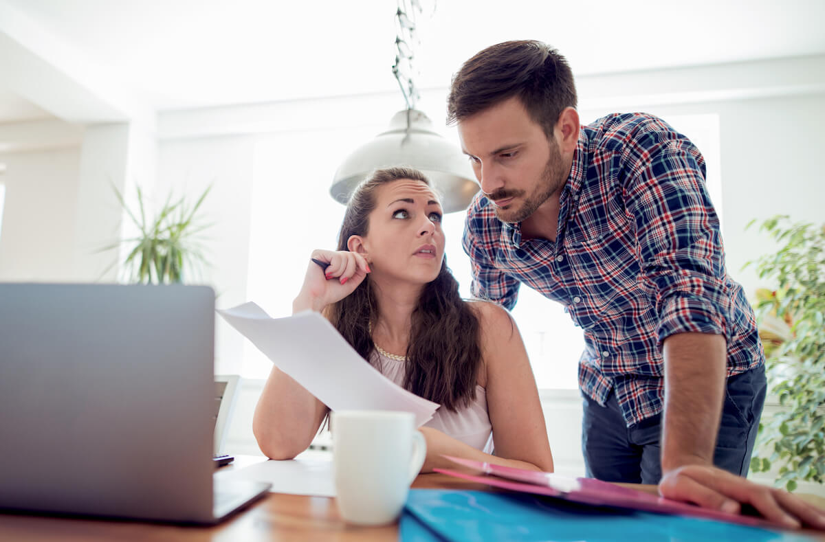 Couple Reviewing Insurance Claim Policy