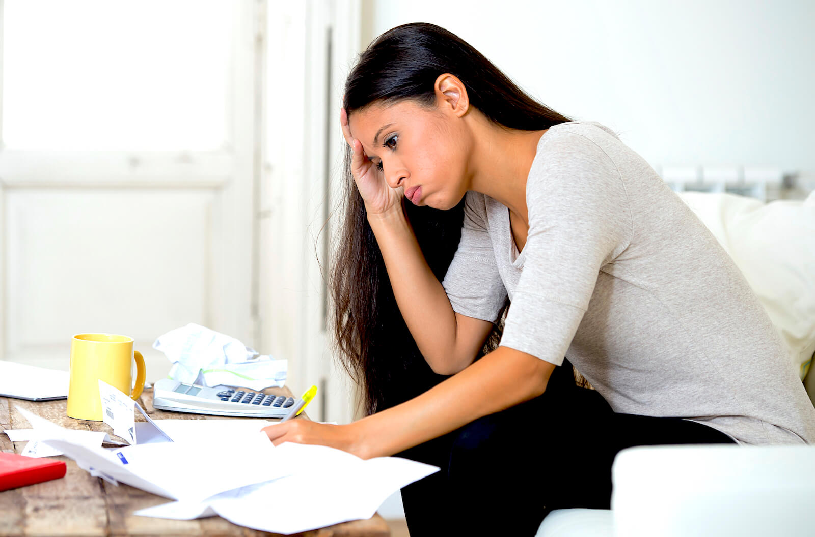 Woman Working On Insurance Claim Paperwork