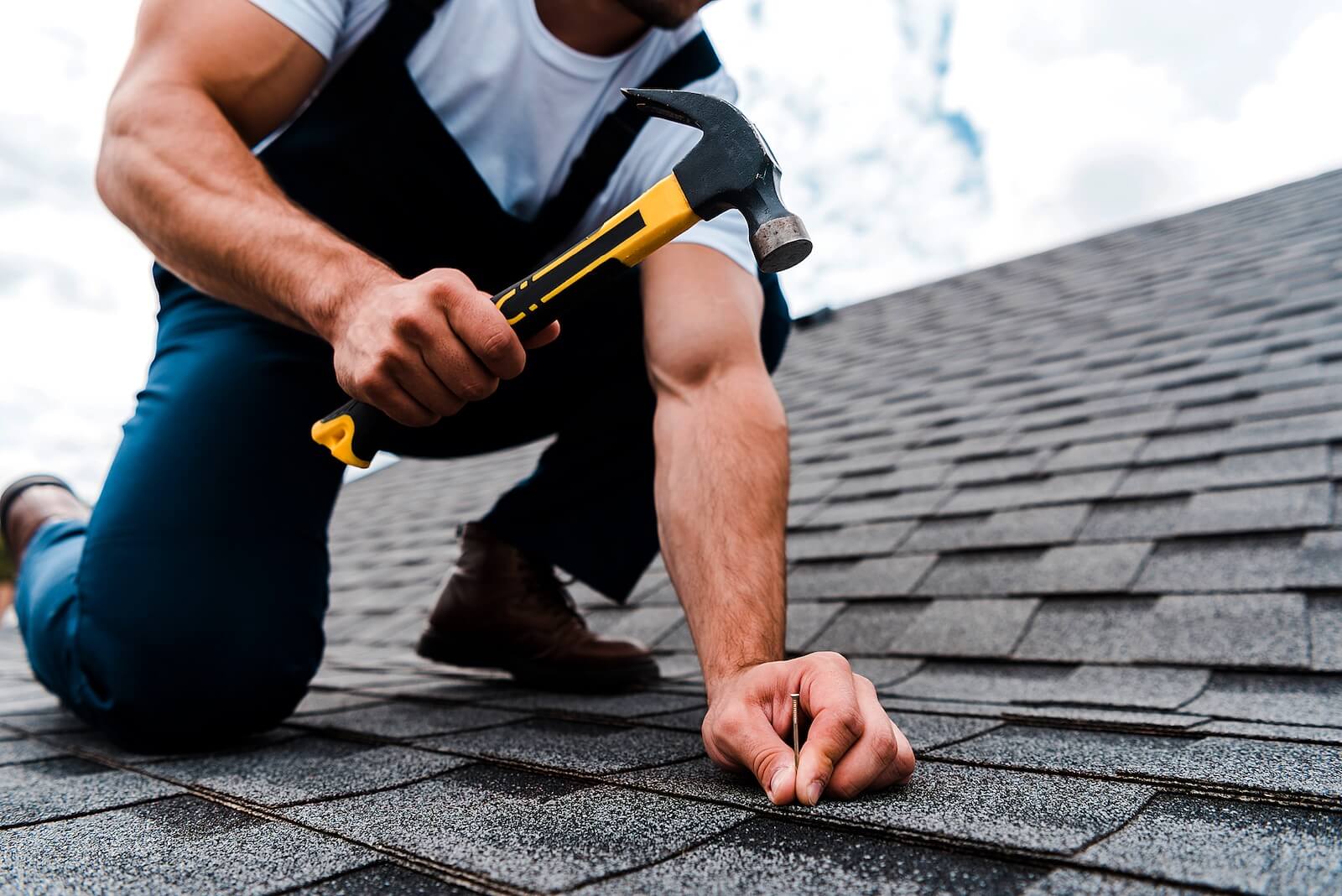 Man Repairing Roof