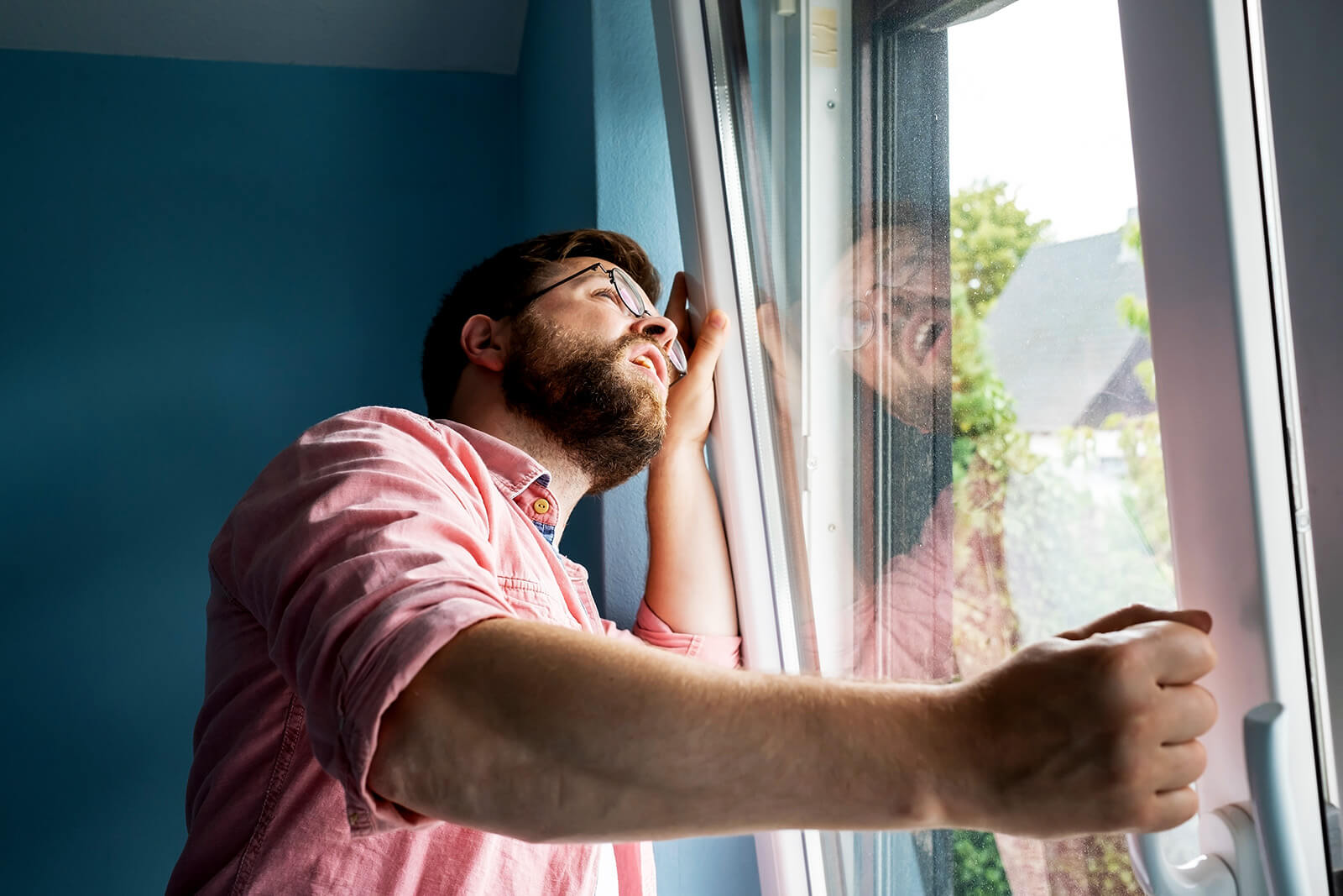 Man Checking Windows For Leaks