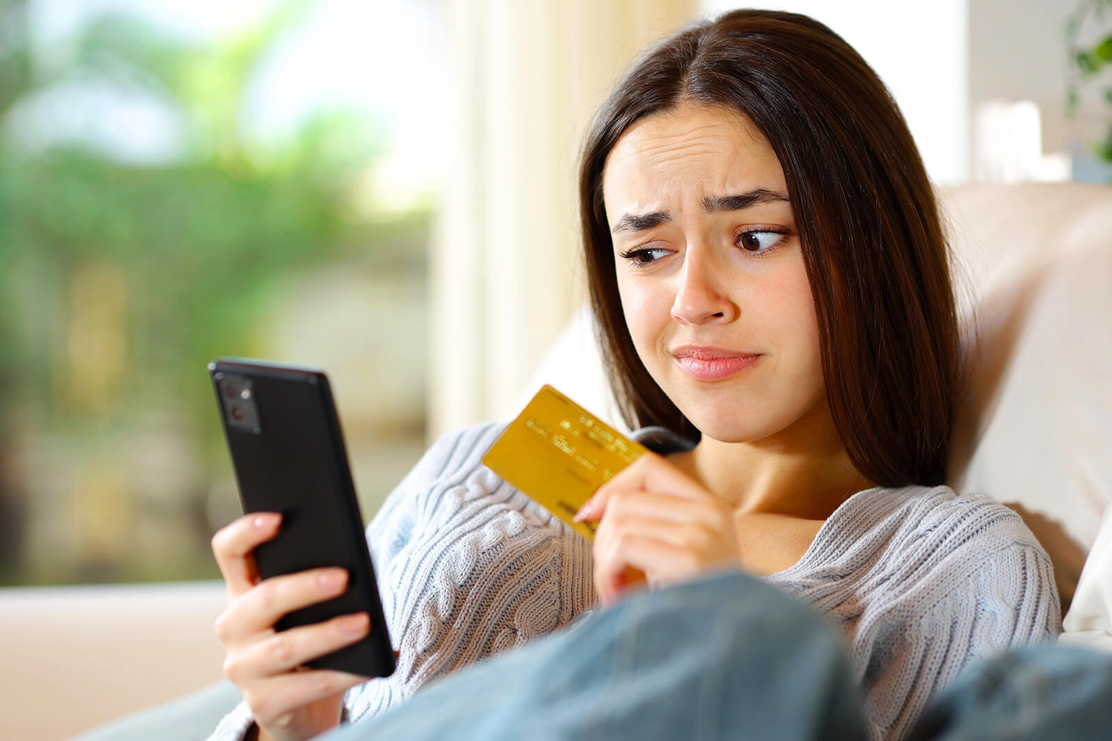 Woman Contemplating Keeping A Home Inventory